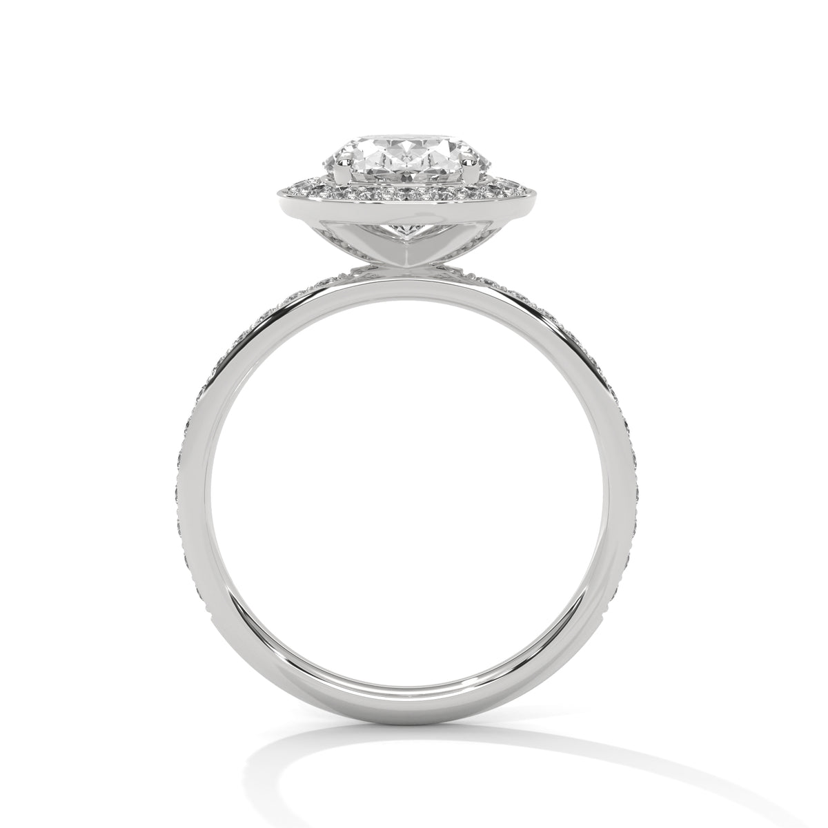 Diamond ring with a halo setting on a white background