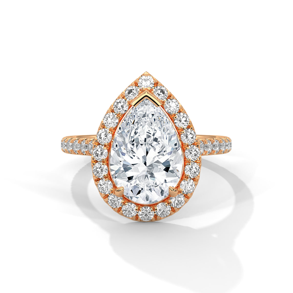 Rose gold ring with a pear-shaped diamond on a white background