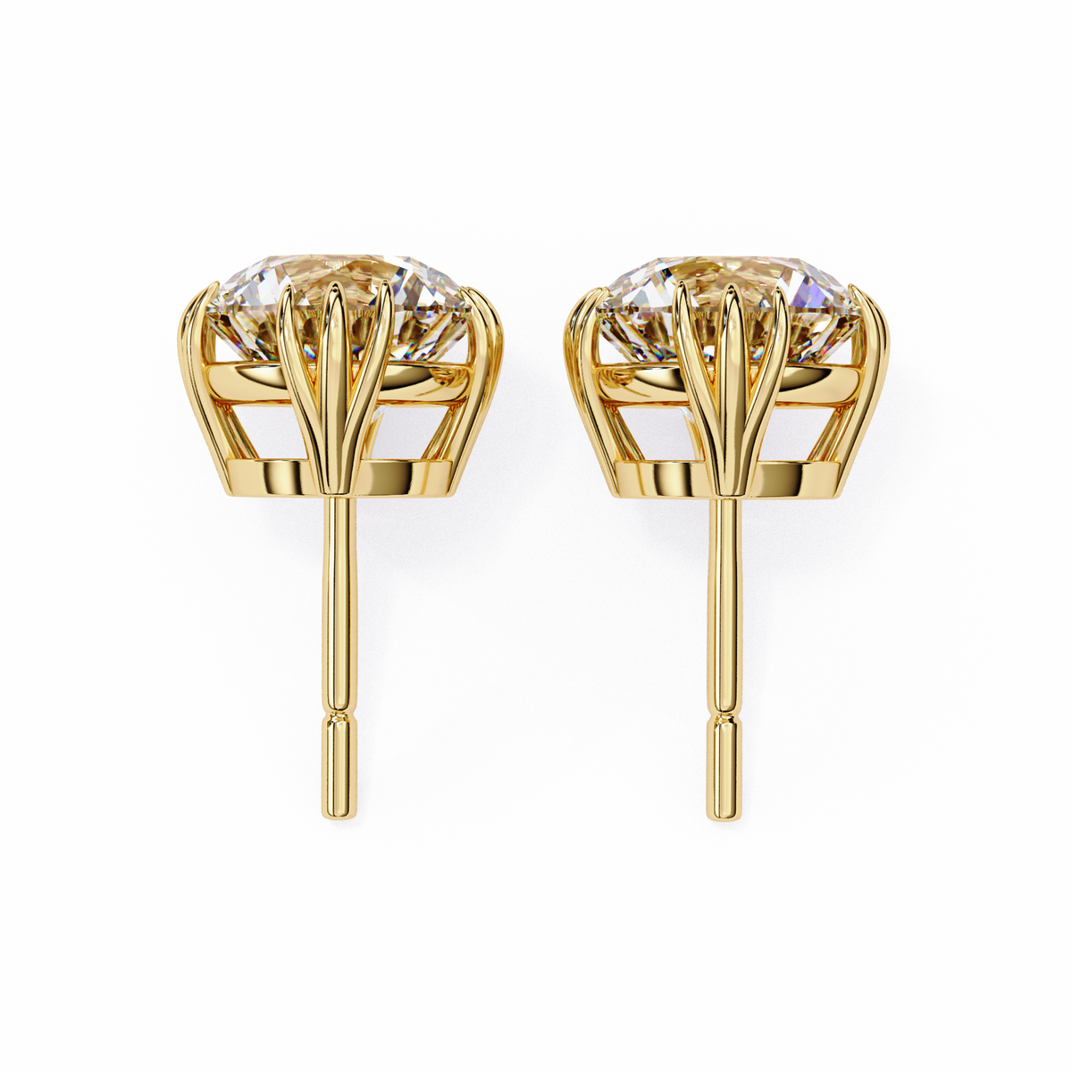 Gold earrings with clear gemstones on a white background