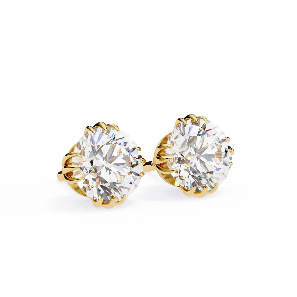 Gold earrings with large clear gemstones on a white background