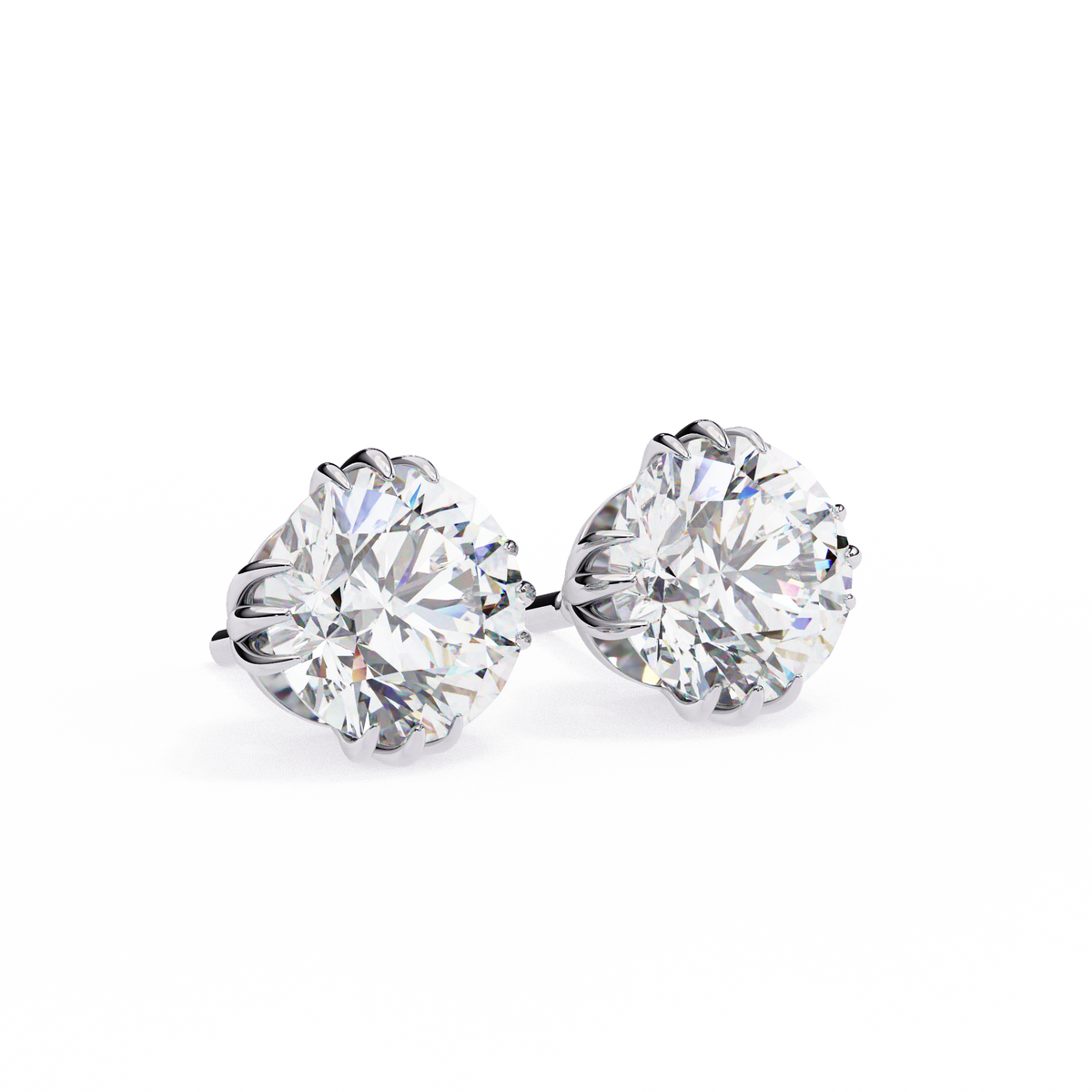 A pair of round brilliant-cut diamond stud earrings in a silver-toned setting, photographed on a clean white background.