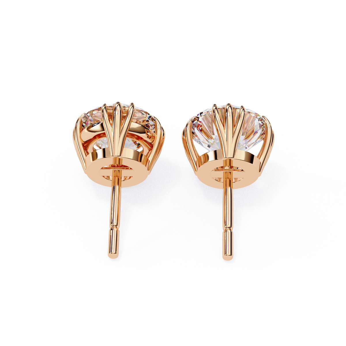 Rose gold earrings with clear gemstones on a white background