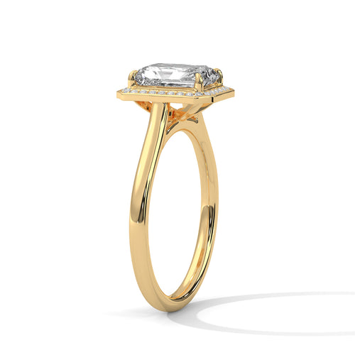 Gold ring with a diamond on a white background