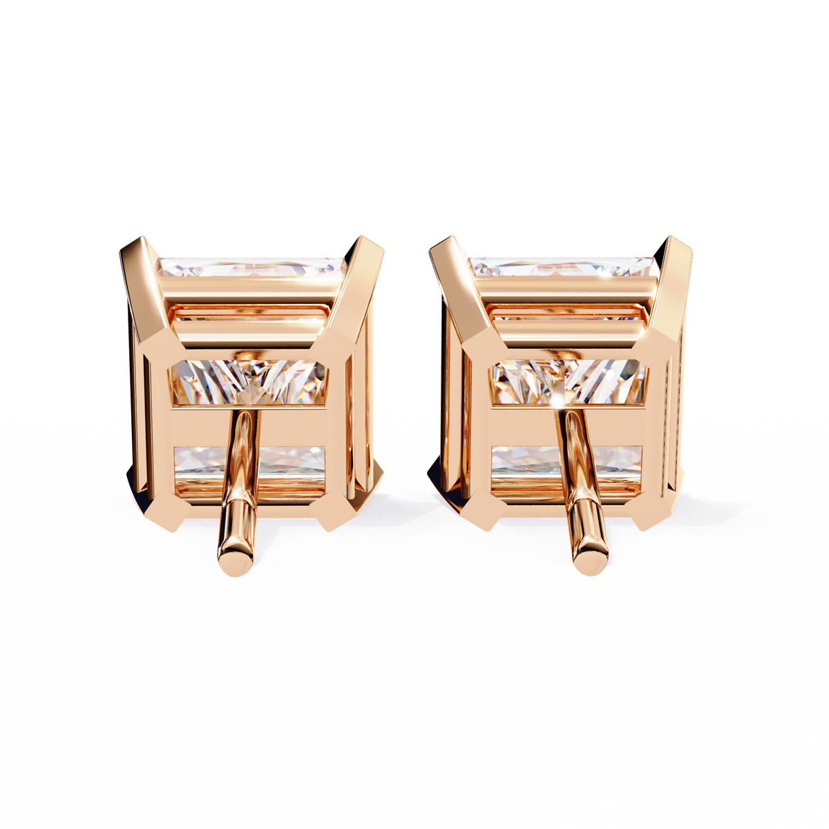 Rose gold earrings with clear gemstones on a white background