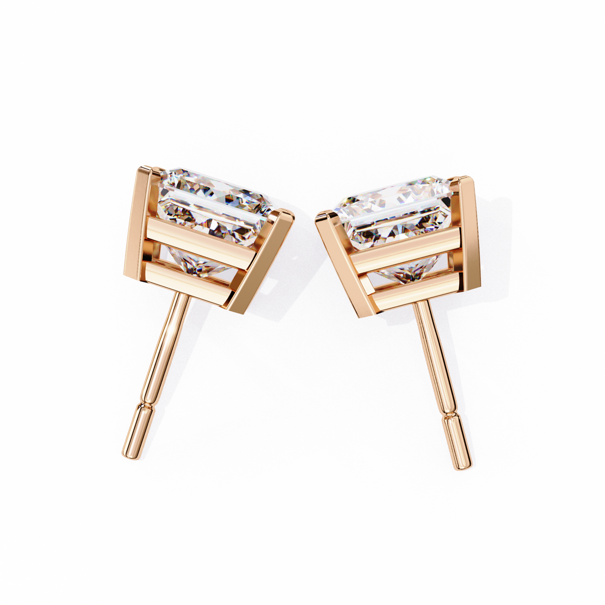 Rose gold earrings with clear gemstones on a white background