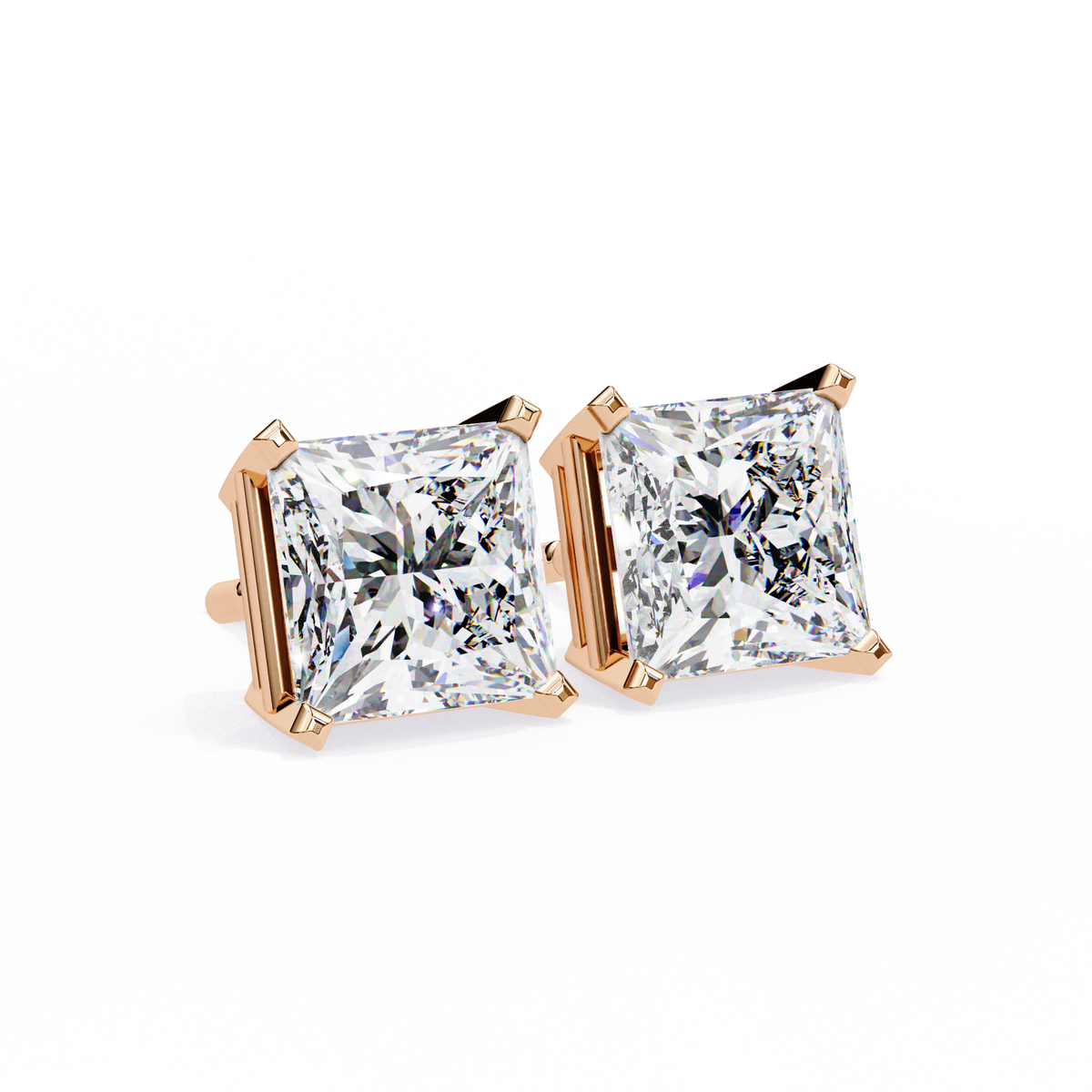 Pair of diamond stud earrings with rose gold prongs on a white background