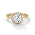 Gold ring with a diamond on a white background