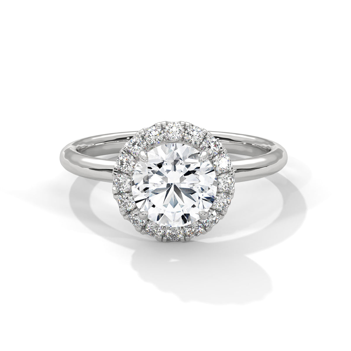 Diamond ring with a halo on a white background