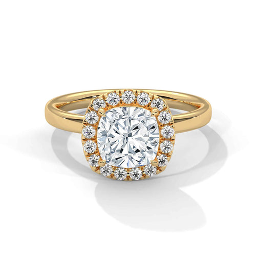 A yellow gold ring with a large round brilliant-cut center diamond surrounded by a halo of smaller diamonds, set on a polished gold band against a clean white background.