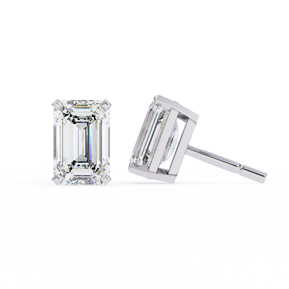 Pair of emerald-cut diamond stud earrings on a white background