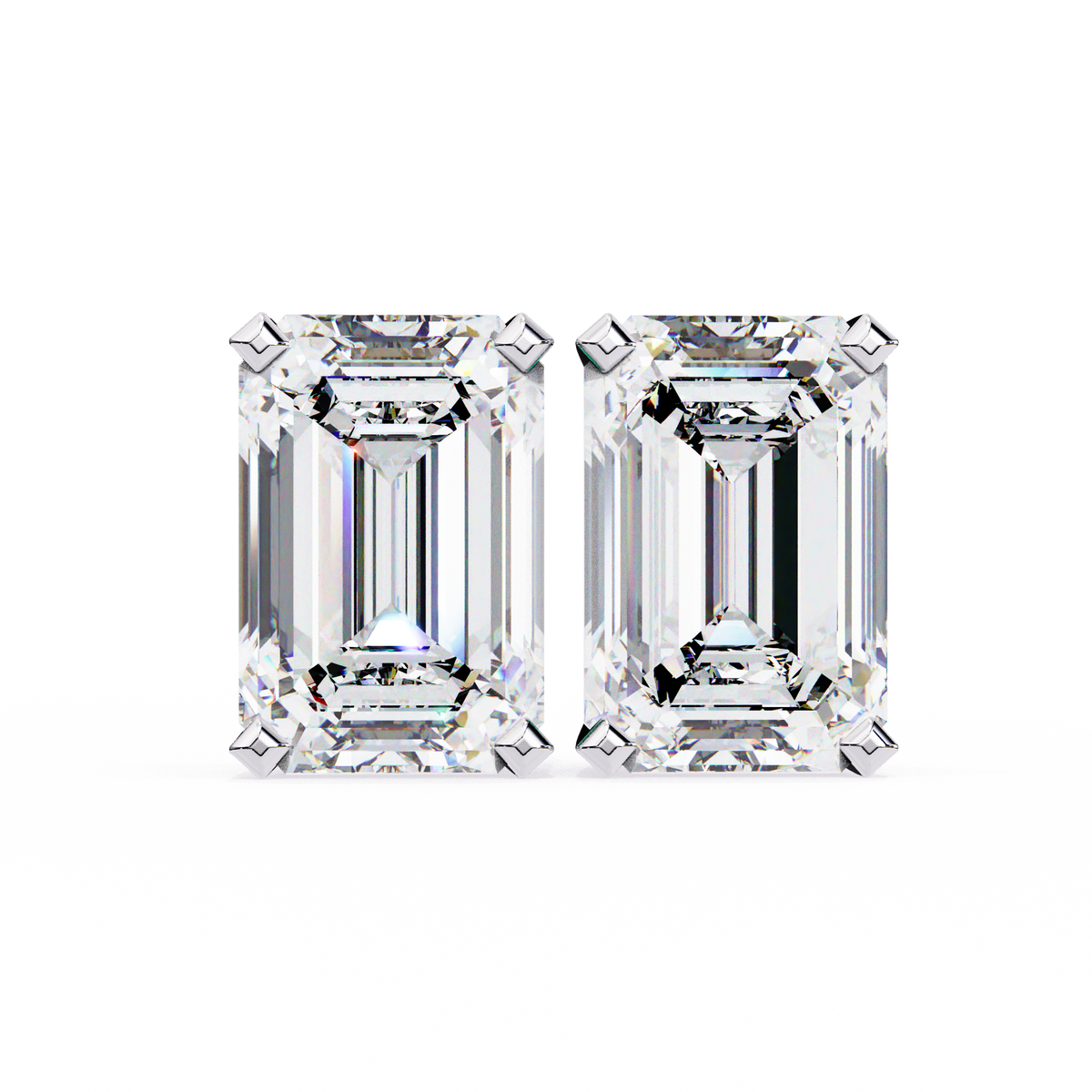 Two emerald-cut diamonds on a white background