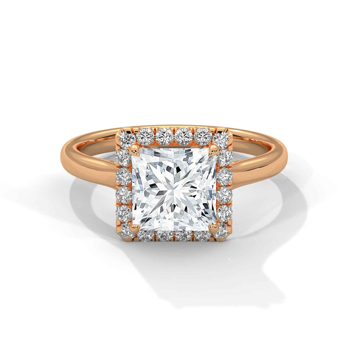 A rose gold ring featuring a large square princess-cut diamond center stone surrounded by a double halo of smaller round diamonds, set on a polished band against a clean white background.