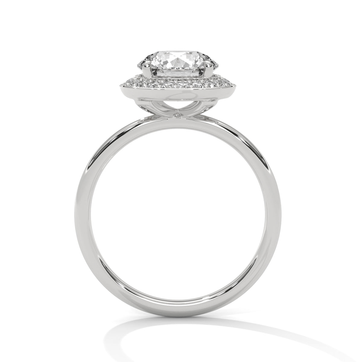 Diamond ring with a halo setting on a white background