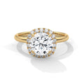 Gold ring with a large diamond and smaller diamonds around on a white background