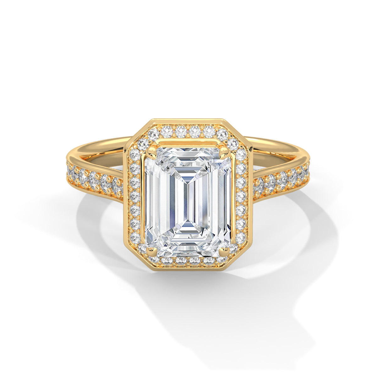 Gold ring with emerald-cut diamond and smaller diamonds on a white background