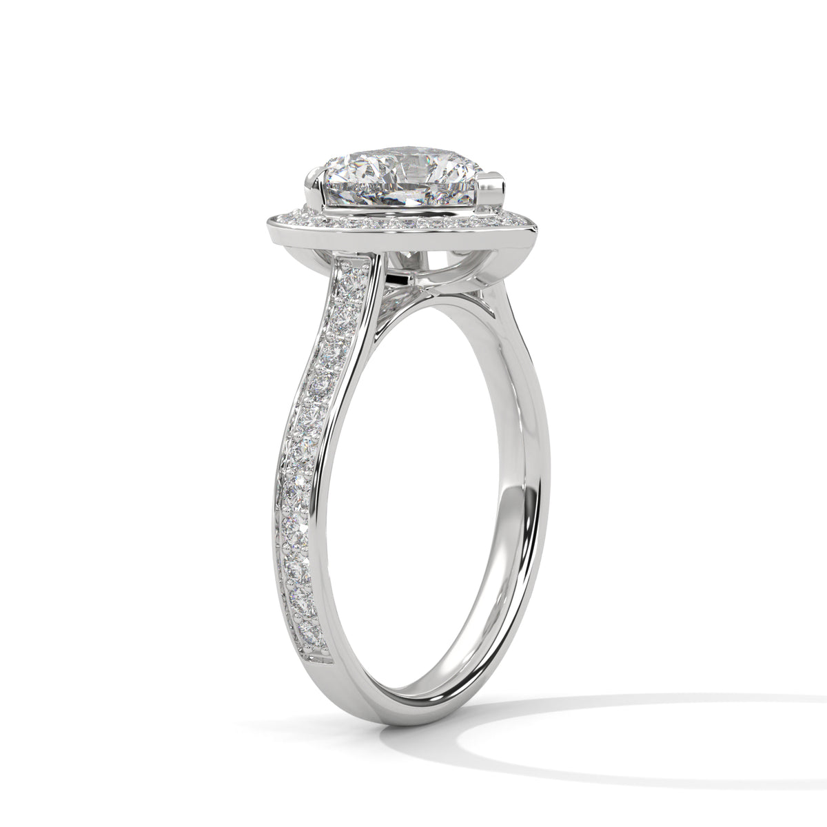 Diamond ring with a halo setting on a white background