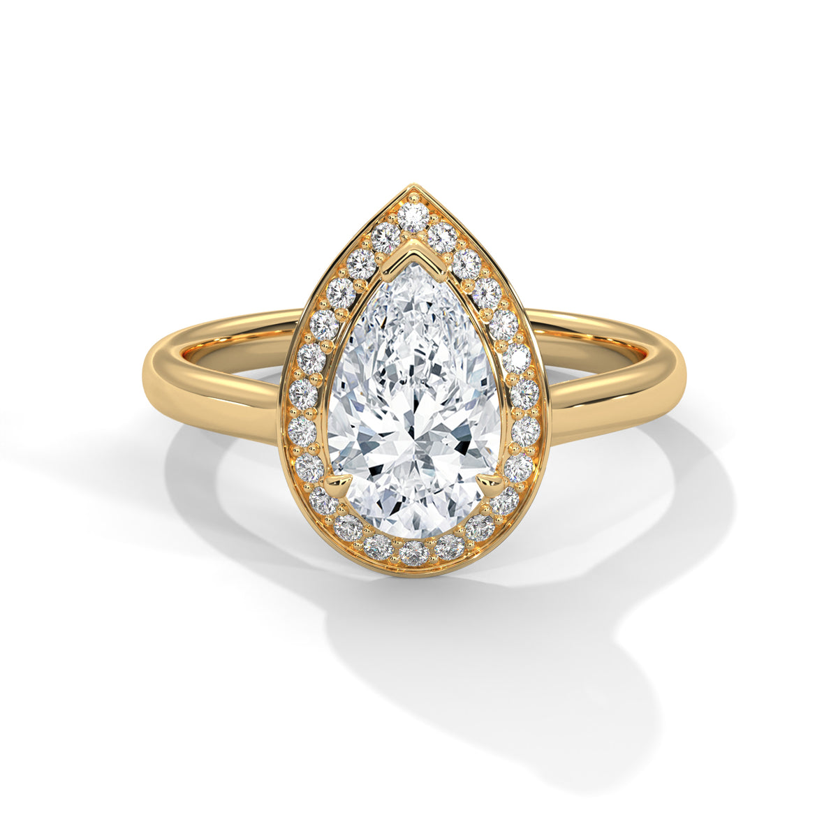Gold ring with a pear-shaped diamond and smaller diamonds on a white background