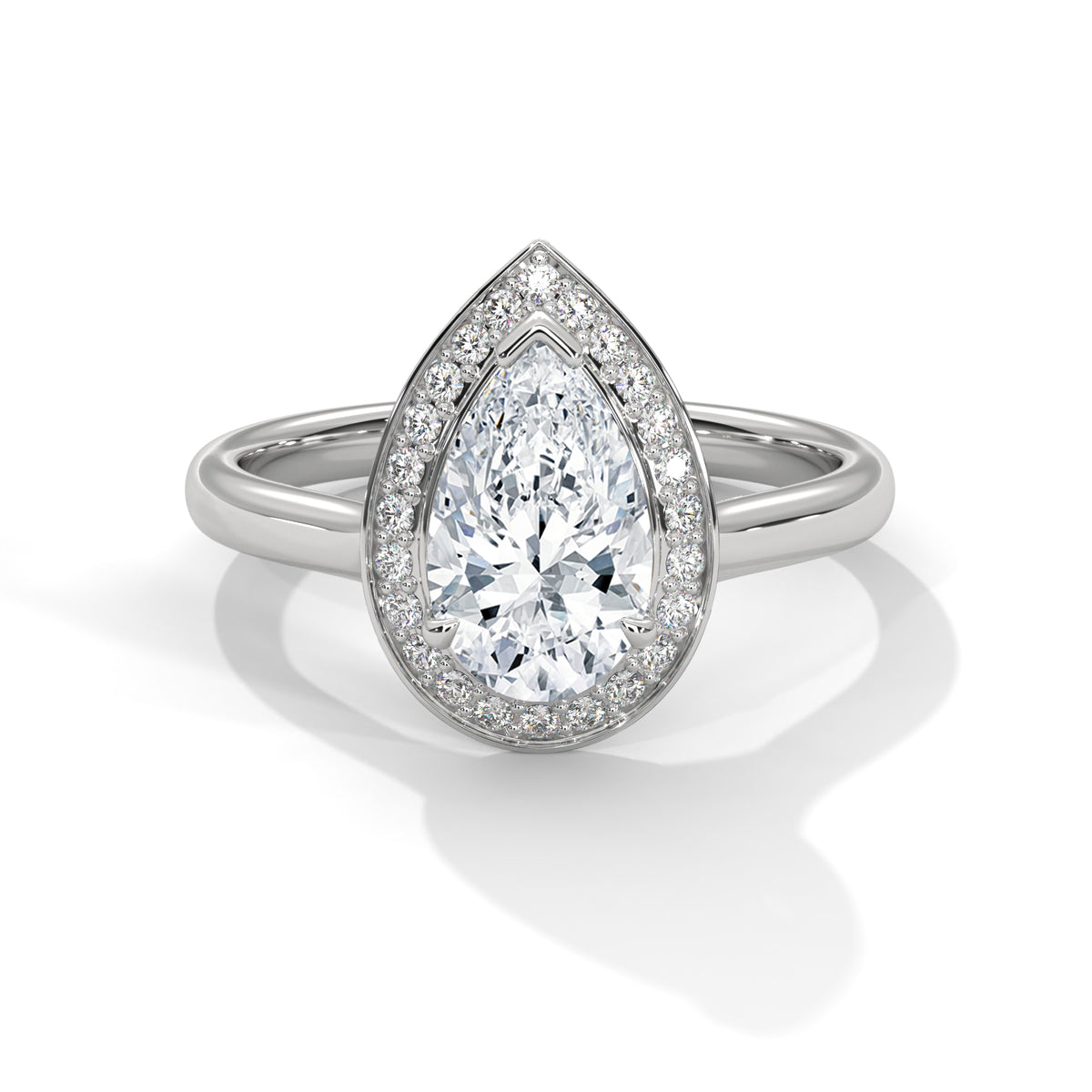 Diamond ring with pear-shaped center stone on a white background