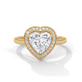 Gold heart-shaped diamond ring on a white background