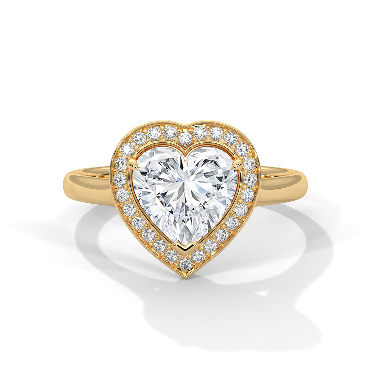 Gold heart-shaped diamond ring on a white background