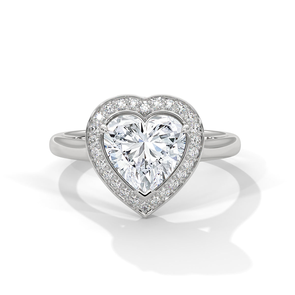 Heart-shaped diamond ring with a white background