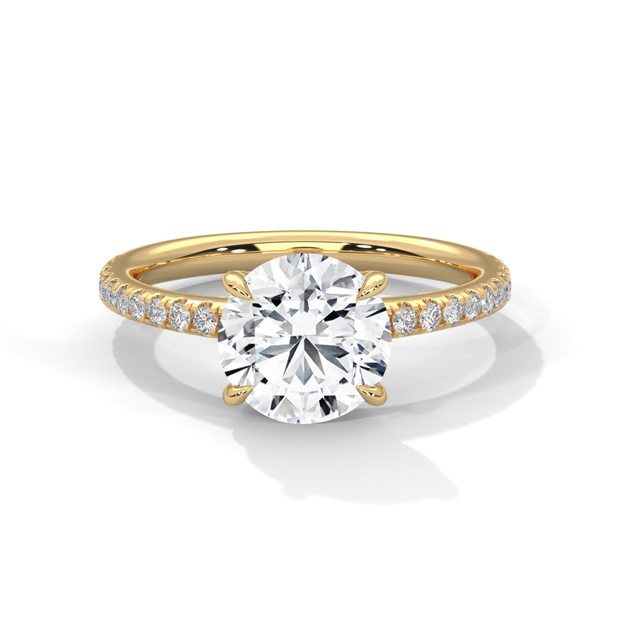 Gold ring with a large diamond and smaller diamonds on the band against a white background