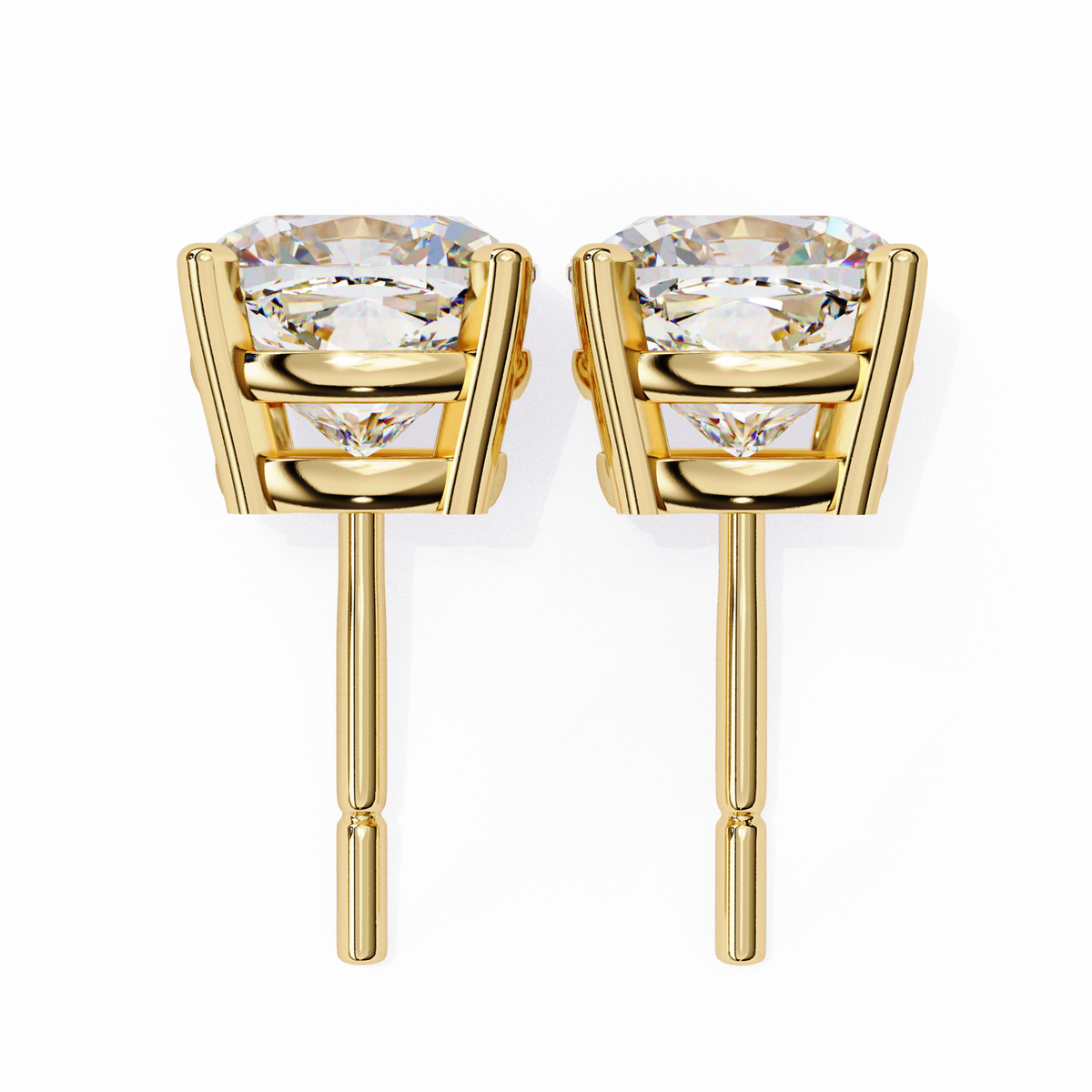 Gold stud earrings with clear gemstones on a white background