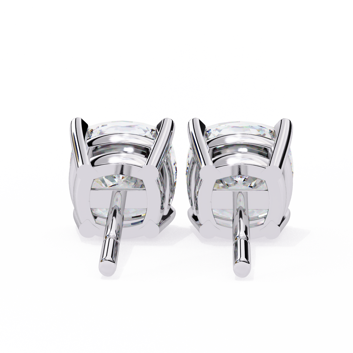 Pair of silver stud earrings on a white background