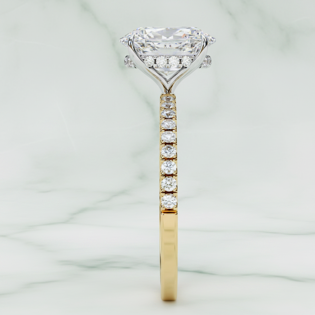 Diamond ring with a yellow gold band on a white background