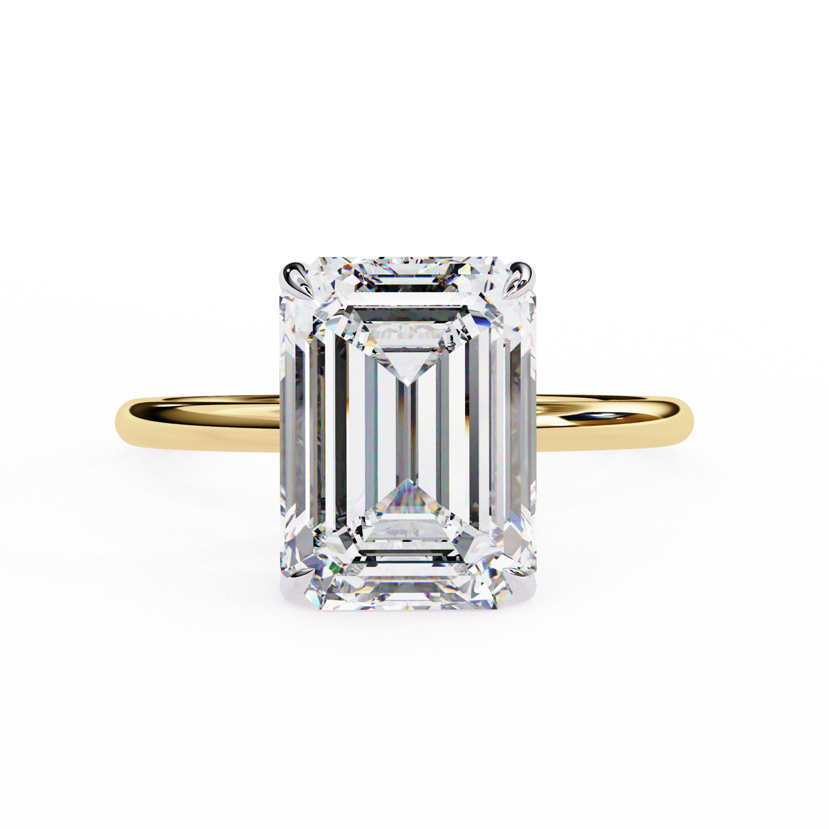 Gold ring with a large emerald-cut diamond on a white background
