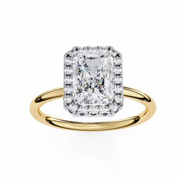 Gold ring with a large diamond on a white background