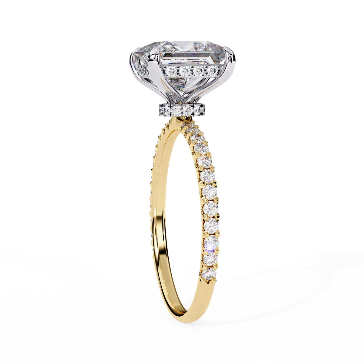 Diamond ring with yellow gold band on a white background