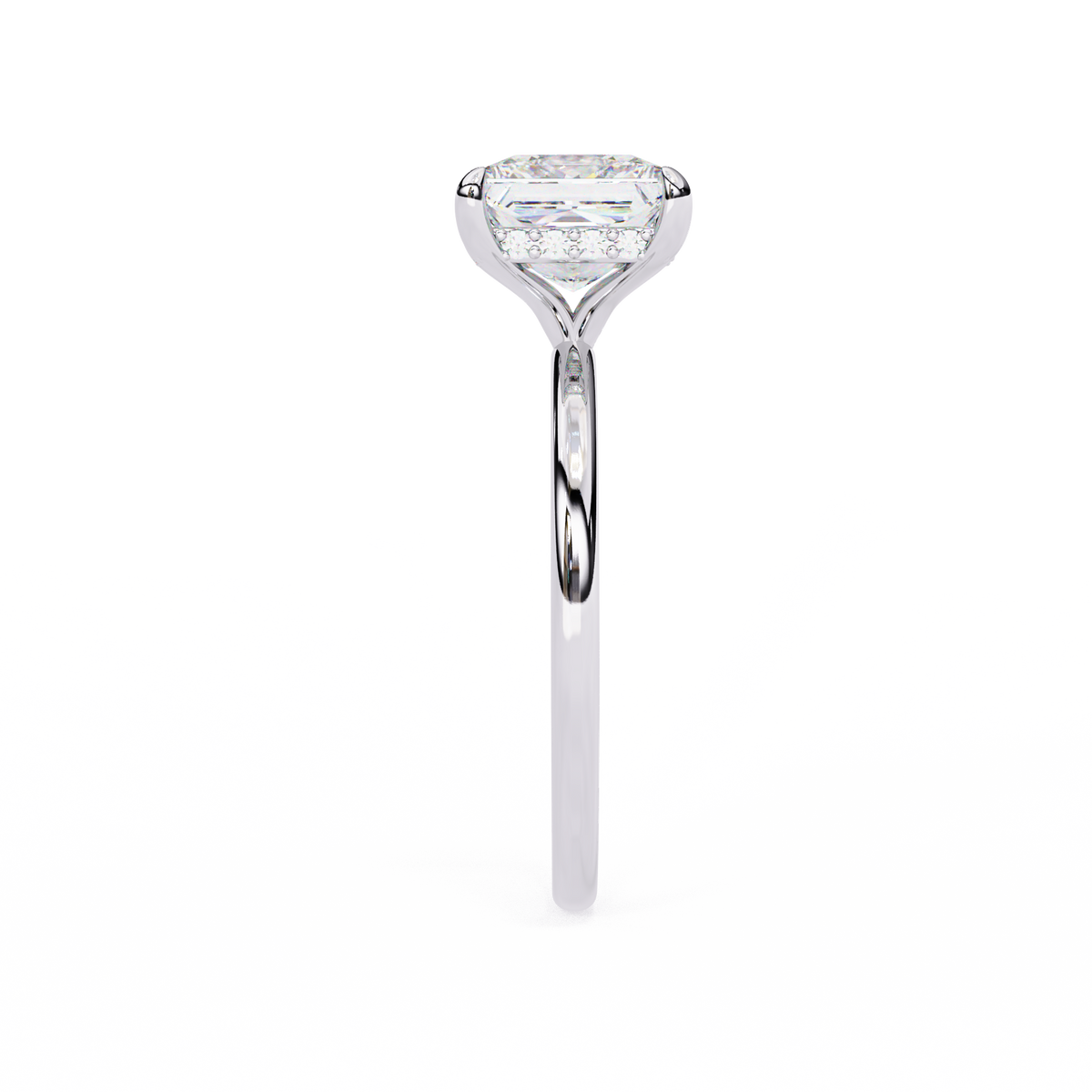 A single diamond engagement ring with a large cushion-cut center stone and a halo of smaller diamonds, set in a polished silver-colored band against a plain white background.