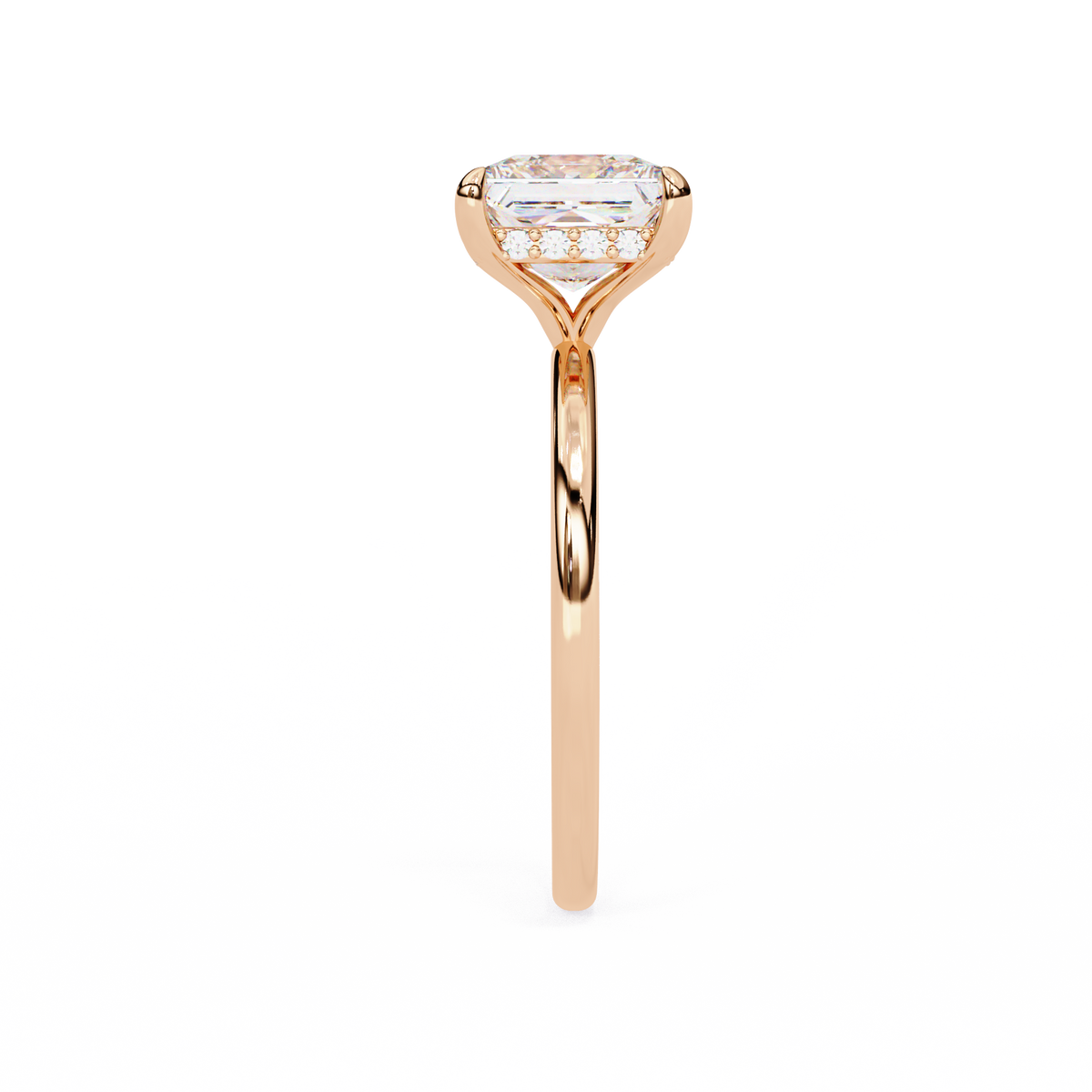 Rose gold ring with a diamond on a white background