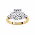 Gold ring with a large diamond and smaller diamonds on a white background