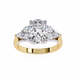 Gold ring with a large diamond and smaller diamonds on a white background