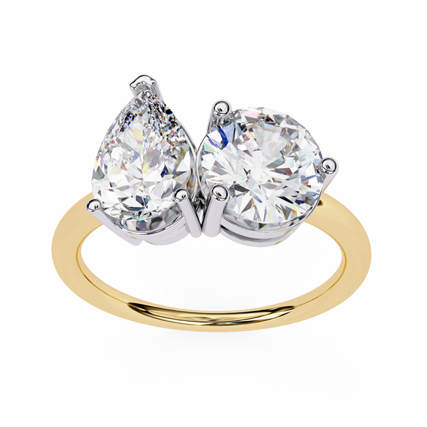 Gold ring with two large clear gemstones on a white background