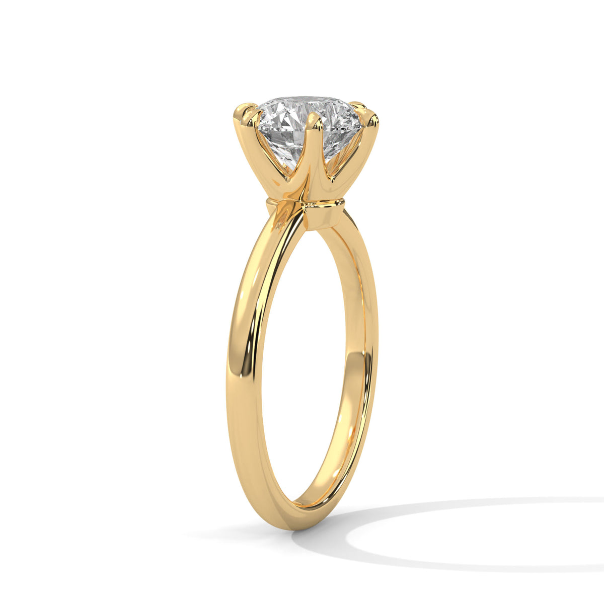 Gold ring with a diamond on a white background
