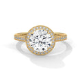 Gold ring with a large diamond and smaller diamonds on the band against a white background