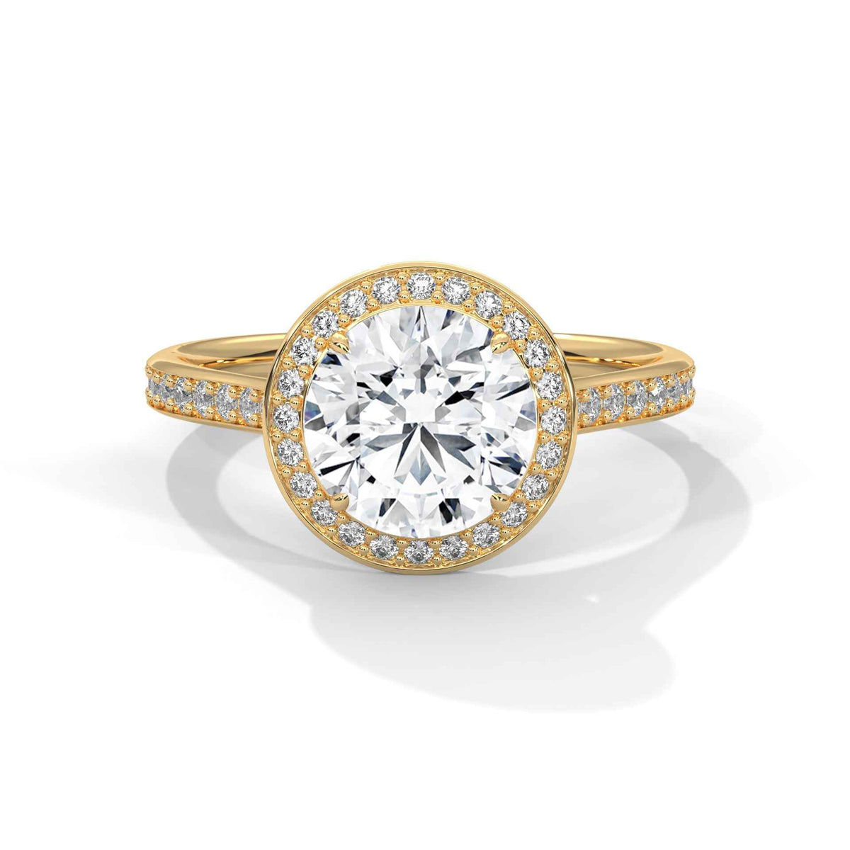 Gold ring with a large diamond and smaller diamonds on the band against a white background