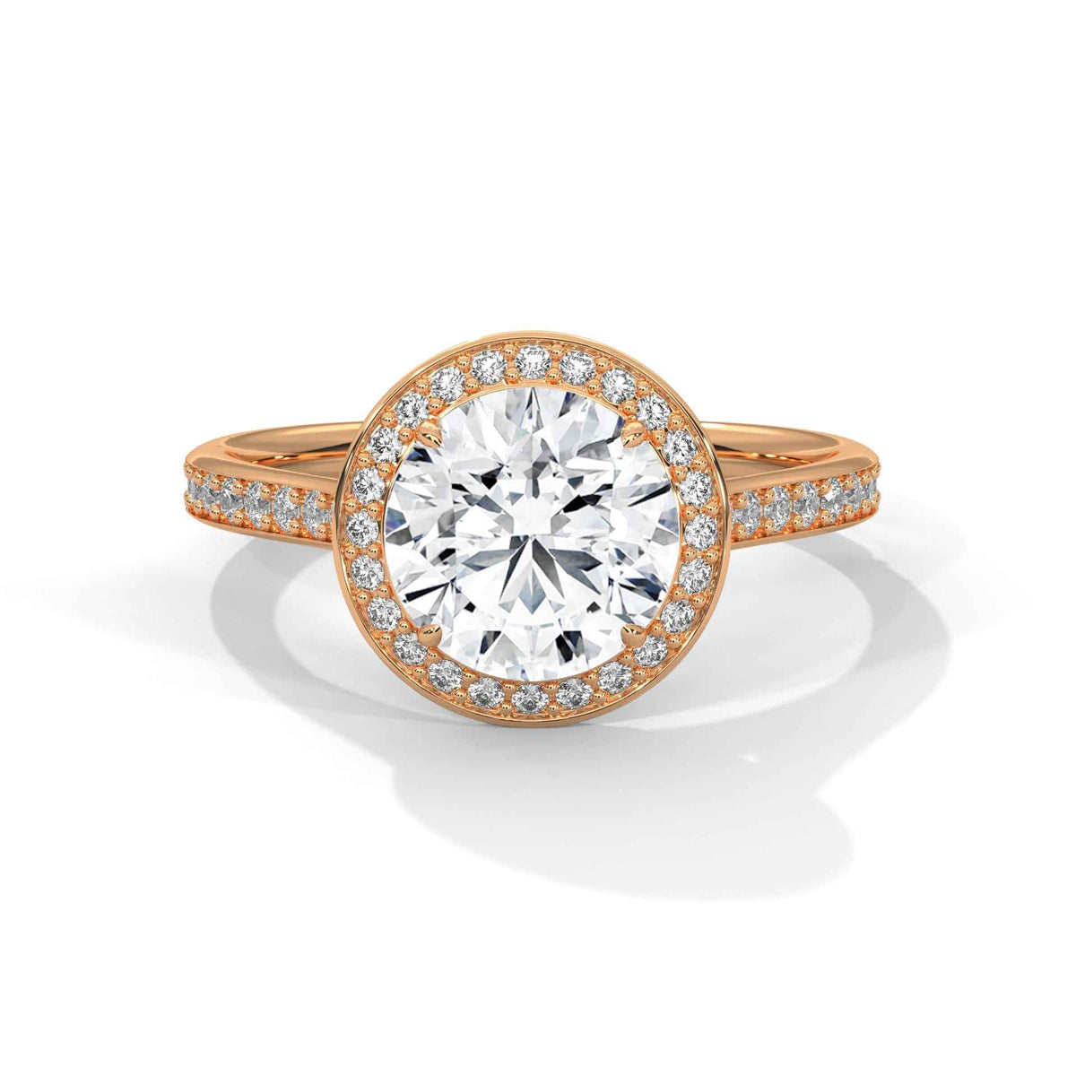 A rose gold halo ring featuring a large round-cut center stone surrounded by a halo of small pavé-set diamonds, with additional diamonds along the shoulders of the band, shown on a clean white background.