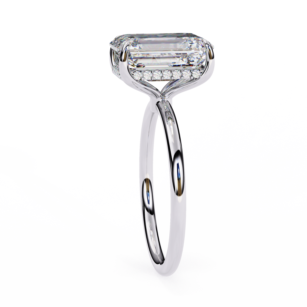 Diamond ring with a rectangular center stone on a white background