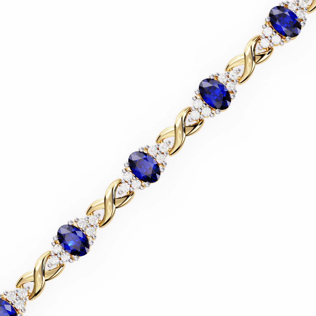 Gold bracelet with blue gemstones on a white background