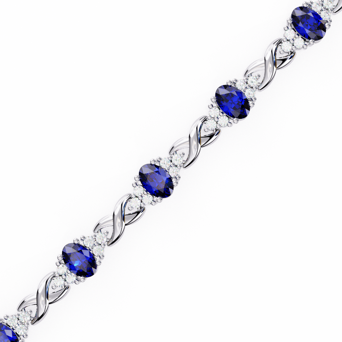 Silver bracelet with blue gemstones on a white background