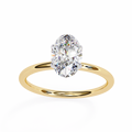Gold ring with a large diamond on a white background