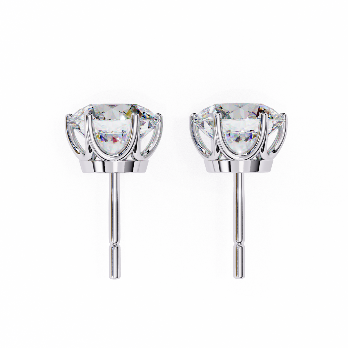 Pair of silver earrings with clear gemstones on a white background