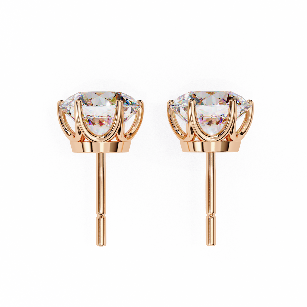 Rose gold earrings with clear gemstones on a white background