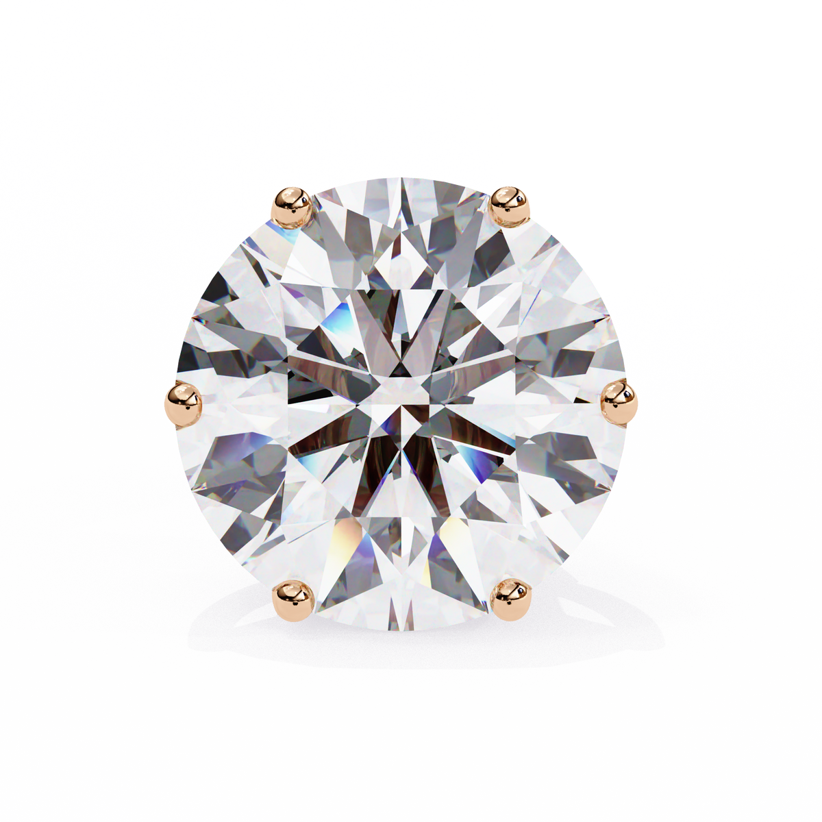Round diamond with gold prongs on a white background
