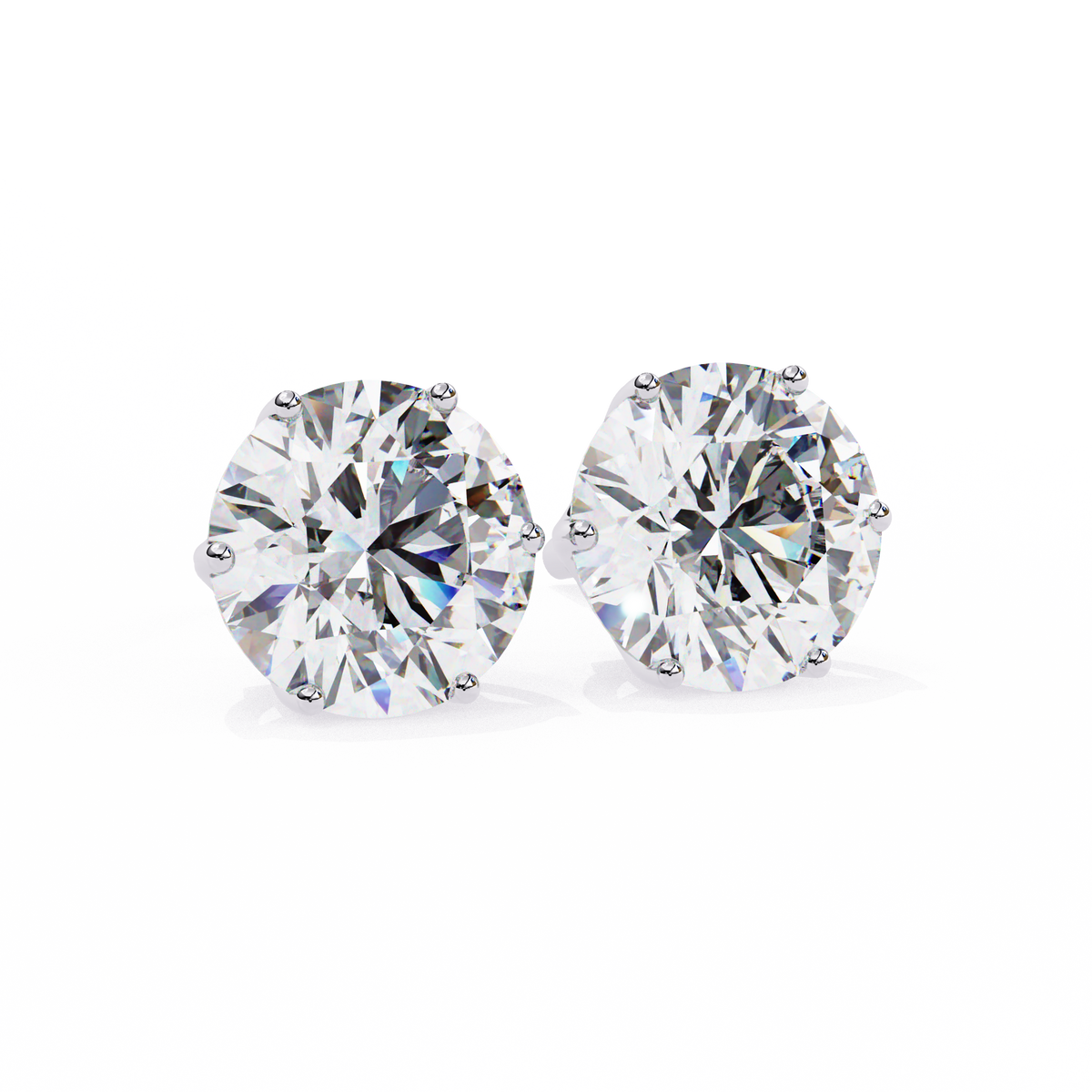 Pair of diamond stud earrings on a white background