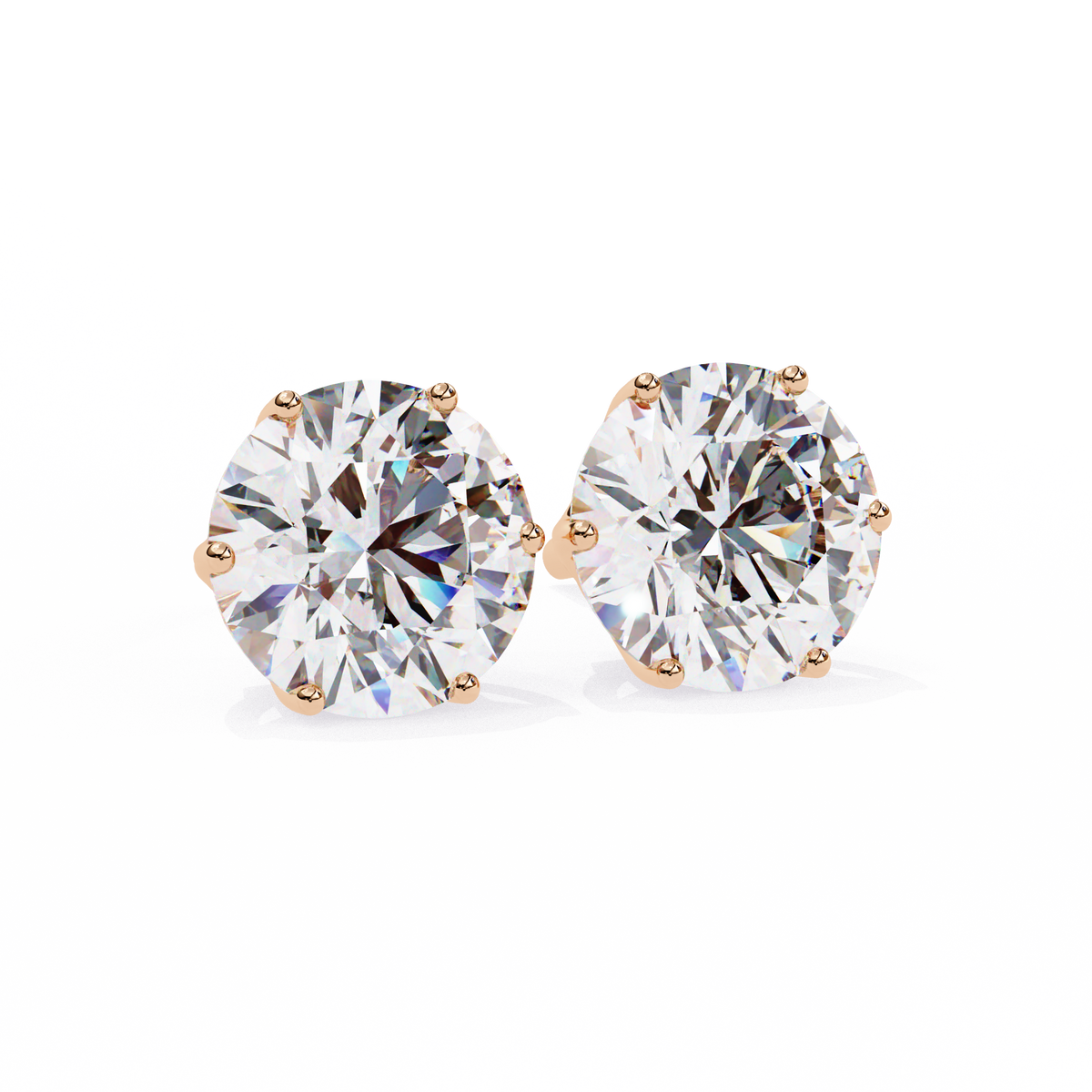 Pair of diamond stud earrings on a white background